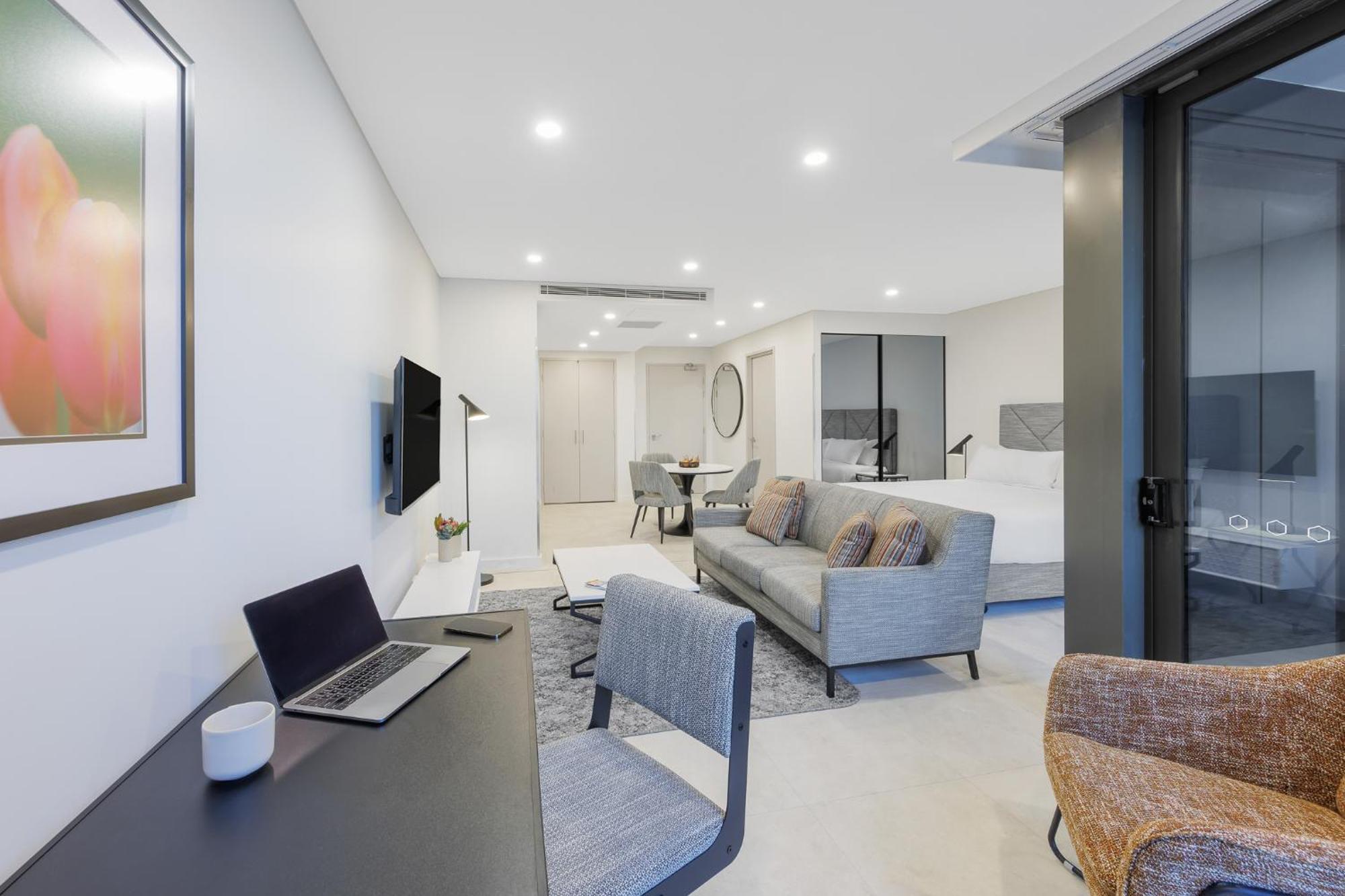 Meriton Suites Canberra Esterno foto A typical apartment interior
